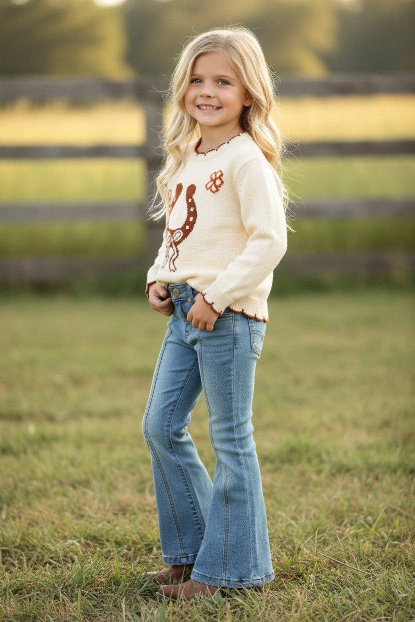 Horse shoe on cream knot pullover sweater w/moon stitch.