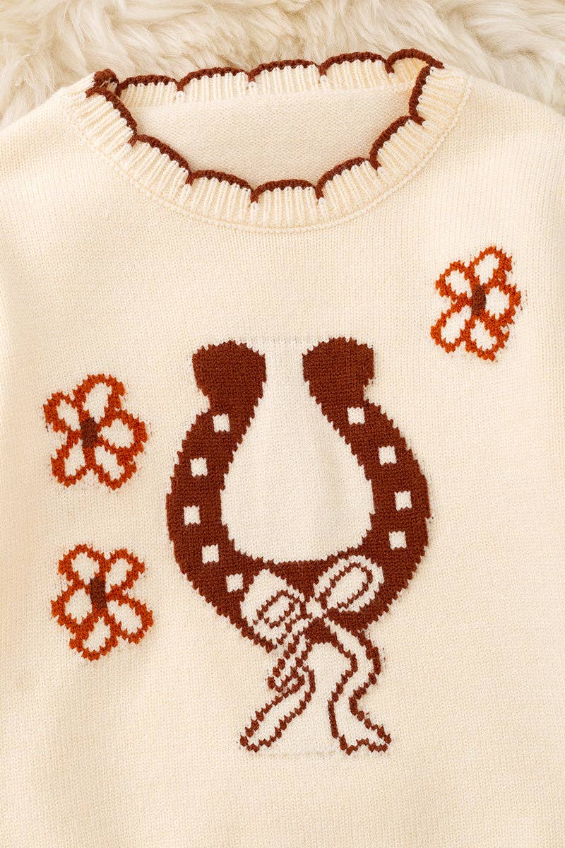 Horse shoe on cream knot pullover sweater w/moon stitch.